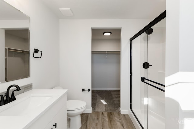 4353 N Magical Creek Ave, Meridian, ID 83646 - full bathroom with toilet, a walk in closet, and a stall shower