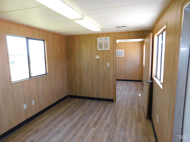 24405 Red Top, Wilder, ID 83676 - unfurnished room featuring wood finished floors and wooden walls