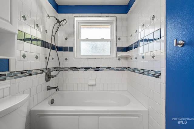 full bathroom featuring toilet and  shower combination