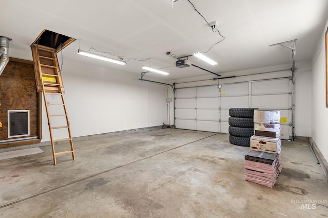 garage featuring baseboards and a garage door opener