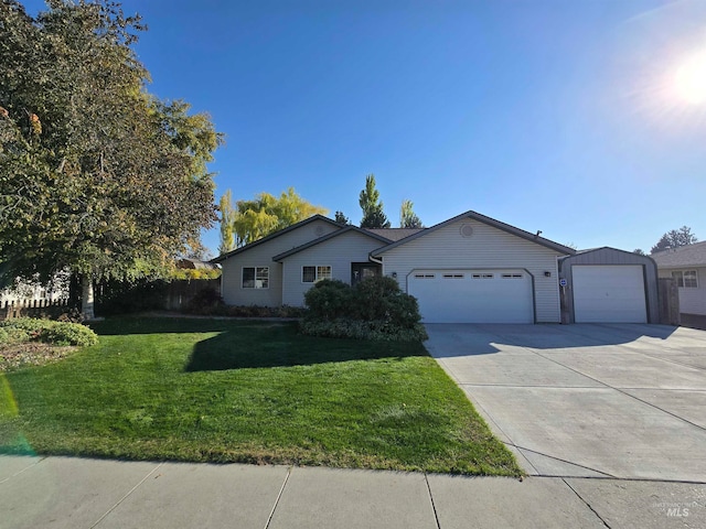 ranch-style home featuring a front yard and a garage