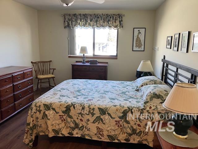 bedroom featuring dark wood-type flooring