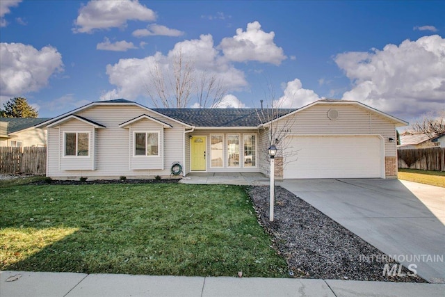 ranch-style home with a garage and a front yard