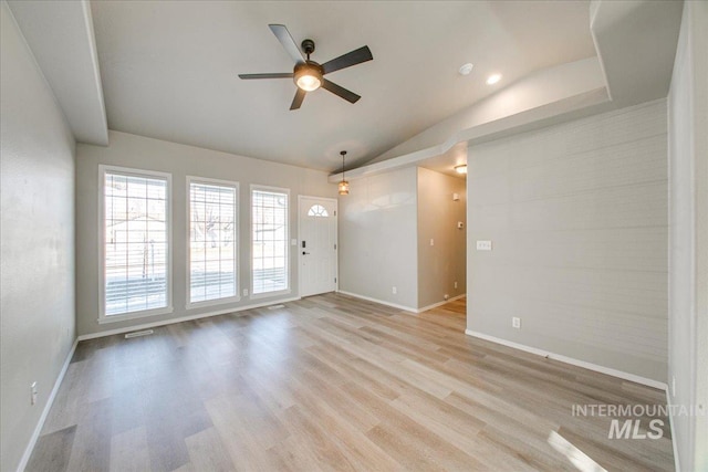 10683 W Capella St, Star, ID 83669 - unfurnished living room featuring ceiling fan, light hardwood / wood-style floors, and lofted ceiling