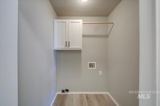 10683 W Capella St, Star, ID 83669 - laundry room with cabinets, washer hookup, and light wood-type flooring
