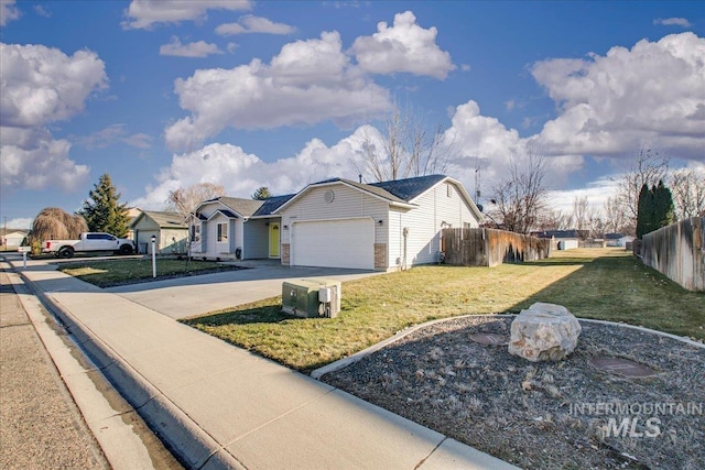 exterior space featuring a lawn and a garage