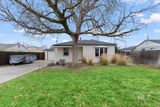 view of front facade with a garage and a front lawn