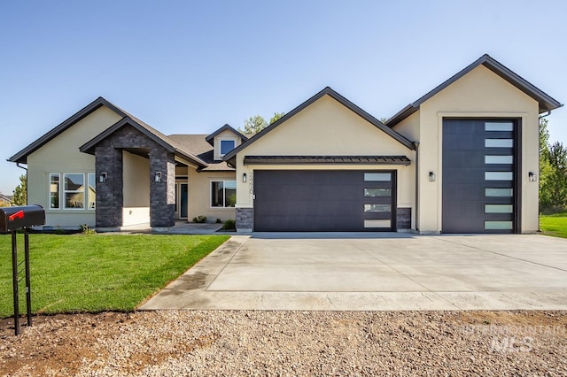 view of front of house with a garage and a front yard