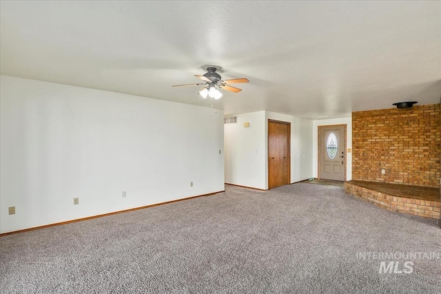 16476 Ustick Rd, Caldwell, ID 83607 - unfurnished living room with carpet floors, ceiling fan, and baseboards