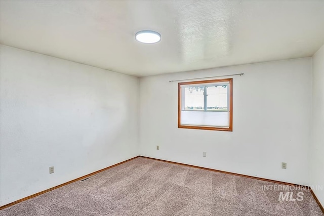 16476 Ustick Rd, Caldwell, ID 83607 - carpeted empty room featuring baseboards