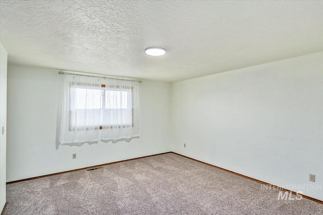 16476 Ustick Rd, Caldwell, ID 83607 - carpeted empty room with baseboards