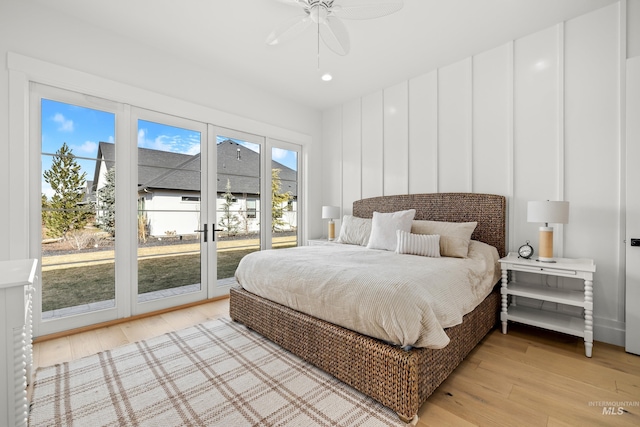 bedroom with access to outside, a ceiling fan, and light wood finished floors