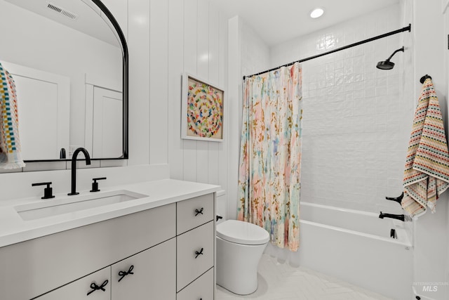 bathroom featuring visible vents, toilet, vanity, and shower / bath combination with curtain