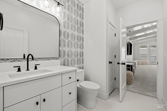 bathroom with toilet and vanity