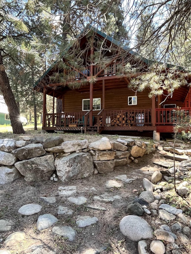 view of property exterior featuring a porch