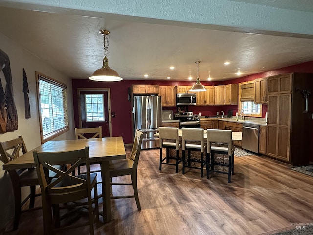 dining space featuring recessed lighting and dark wood finished floors
