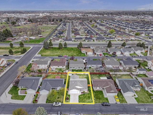 birds eye view of property with a residential view