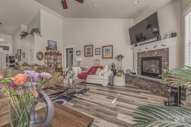420 Poppy St, Fruitland, ID 83619 - living room featuring high vaulted ceiling, ceiling fan, wood finished floors, and a fireplace