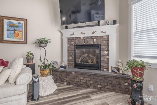 420 Poppy St, Fruitland, ID 83619 - living room featuring wood finished floors and a fireplace