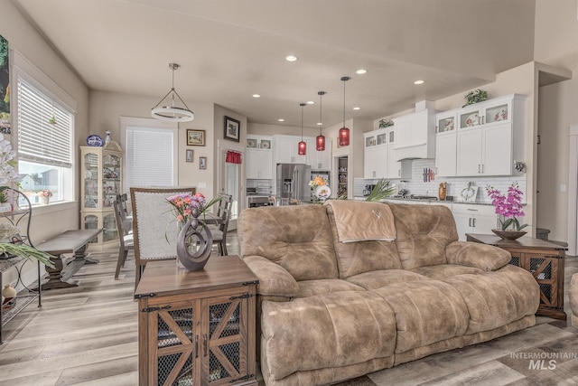 420 Poppy St, Fruitland, ID 83619 - living room with light wood-style flooring and recessed lighting
