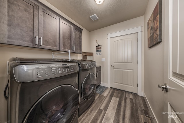 420 Poppy St, Fruitland, ID 83619 - laundry area with cabinet space, independent washer and dryer, baseboards, dark wood-type flooring, and a textured ceiling
