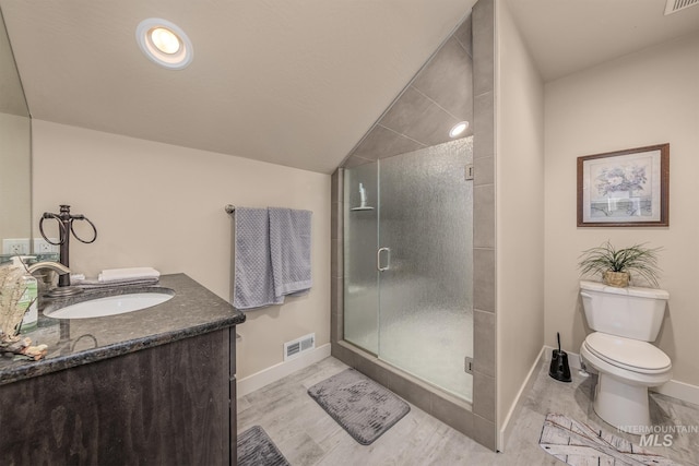 420 Poppy St, Fruitland, ID 83619 - full bathroom featuring toilet, a stall shower, baseboards, vanity, and lofted ceiling