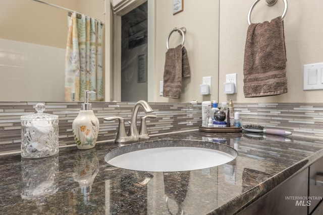 420 Poppy St, Fruitland, ID 83619 - bathroom featuring decorative backsplash and vanity