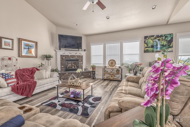 420 Poppy St, Fruitland, ID 83619 - living area featuring a ceiling fan, lofted ceiling, wood finished floors, a fireplace, and recessed lighting