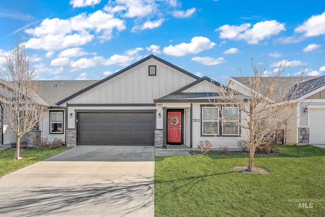 view of front facade with a garage and a front lawn