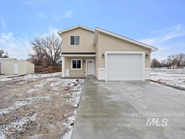 view of front of home with a garage and driveway