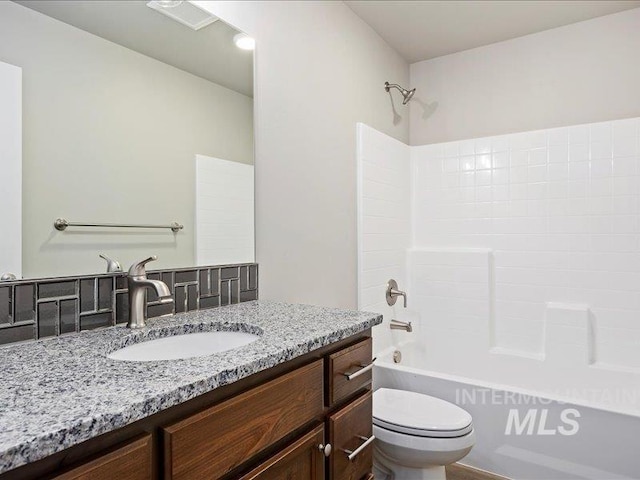 full bath featuring washtub / shower combination, vanity, and toilet