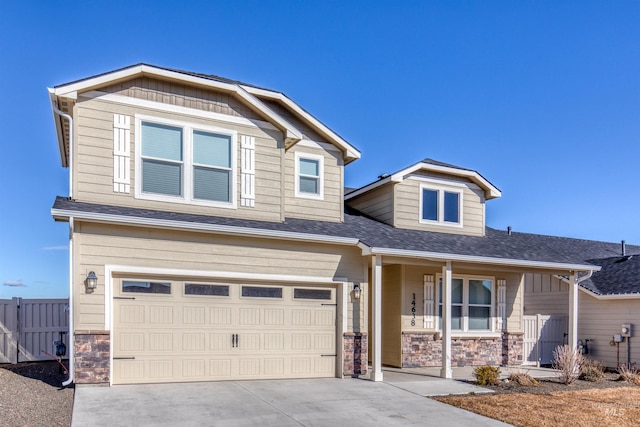 craftsman-style house with covered porch and a garage