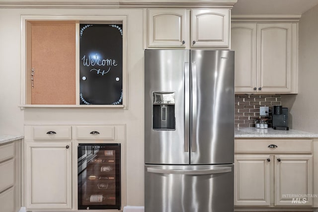 4545 N Columbine St, Boise, ID 83646 - kitchen with stainless steel fridge with ice dispenser, wine cooler, cream cabinets, decorative backsplash, and light stone countertops