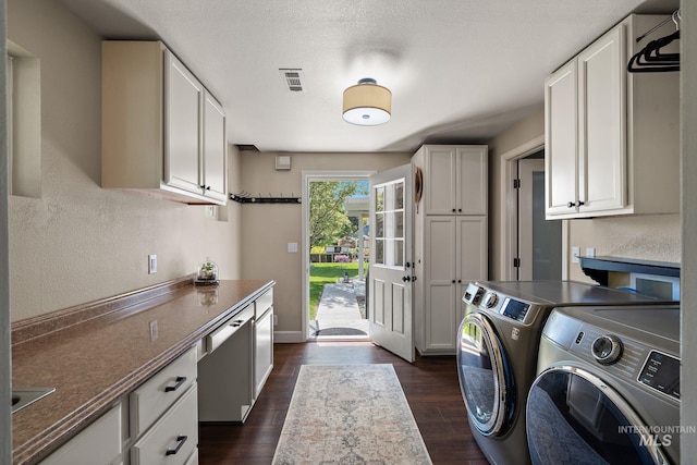 4545 N Columbine St, Boise, ID 83646 - laundry room with washing machine and clothes dryer, cabinet space, dark wood-style flooring, and a textured wall