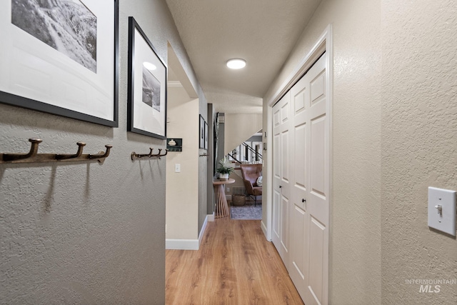 4545 N Columbine St, Boise, ID 83646 - corridor featuring wood finished floors, a textured wall, and baseboards