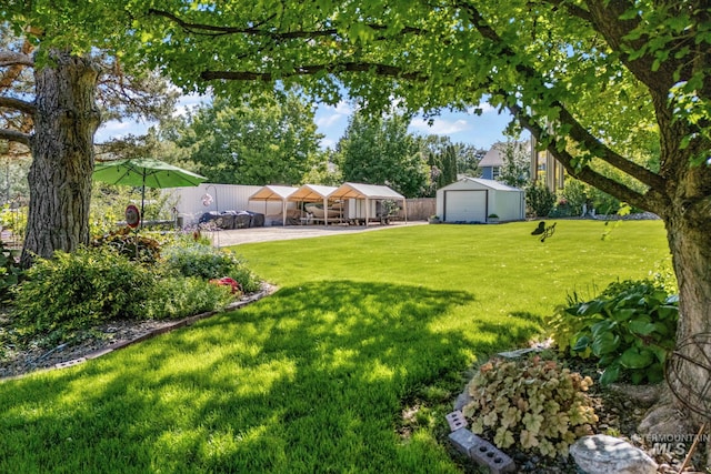 4545 N Columbine St, Boise, ID 83646 - view of yard featuring a carport, an outdoor structure, and a garage