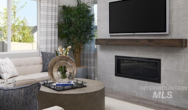 8929 W Reyonlds Creek St, Star, ID 83669 - living area featuring a fireplace and wood finished floors
