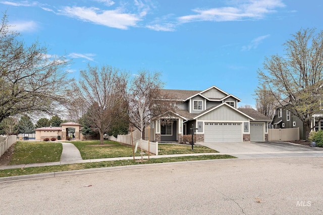 1452 E Pistioa Dr, Meridian, ID 83642 - view of front of house with a garage, concrete driveway, stone siding, and board and batten siding