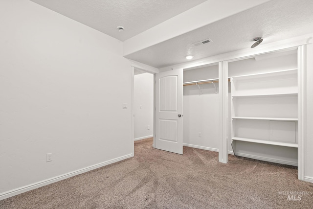 1452 E Pistioa Dr, Meridian, ID 83642 - unfurnished bedroom featuring carpet floors and a textured ceiling