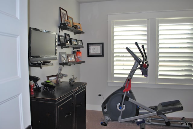 exercise area with a wealth of natural light and baseboards