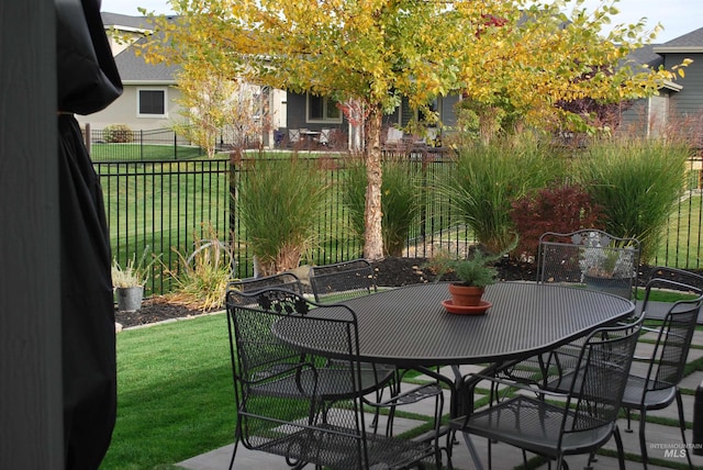 view of patio / terrace featuring outdoor dining area and fence