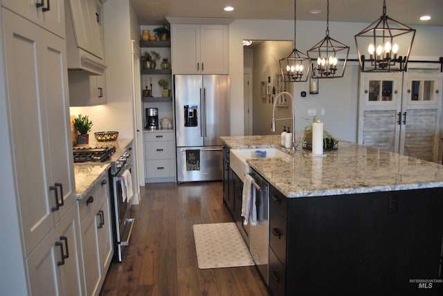 kitchen with dark wood-type flooring, a sink, open shelves, white cabinetry, and appliances with stainless steel finishes