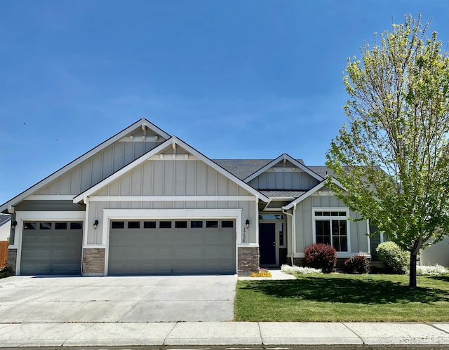 1756 N Hornback Ave, Star, ID 83669 - craftsman inspired home with a garage, concrete driveway, board and batten siding, a front lawn, and a shingled roof