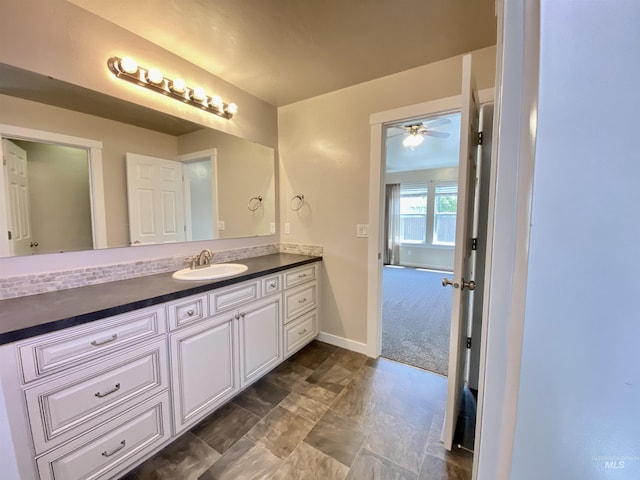 1756 N Hornback Ave, Star, ID 83669 - bathroom featuring vanity, baseboards, and a ceiling fan