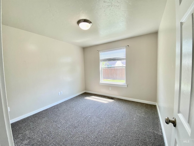 1756 N Hornback Ave, Star, ID 83669 - carpeted spare room with baseboards and a textured ceiling