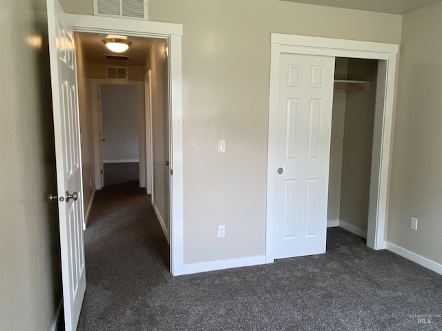 1756 N Hornback Ave, Star, ID 83669 - unfurnished bedroom featuring dark colored carpet, baseboards, and a closet