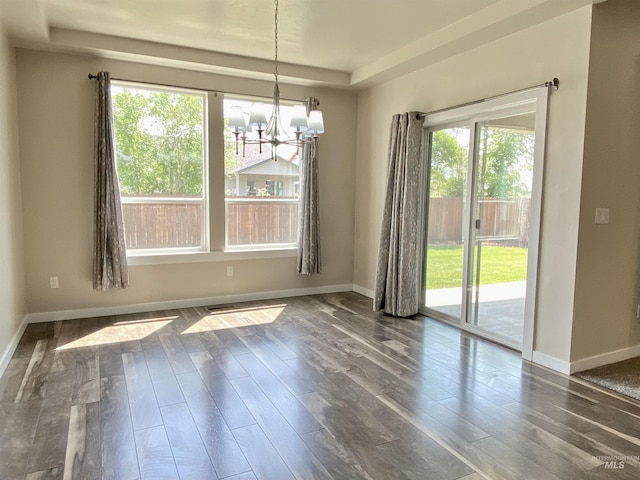 1756 N Hornback Ave, Star, ID 83669 - unfurnished dining area featuring a chandelier, dark wood-style floors, and baseboards