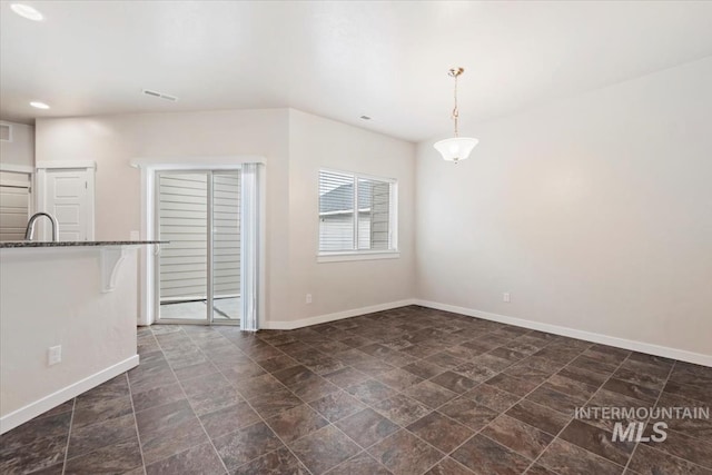 interior space with baseboards and visible vents