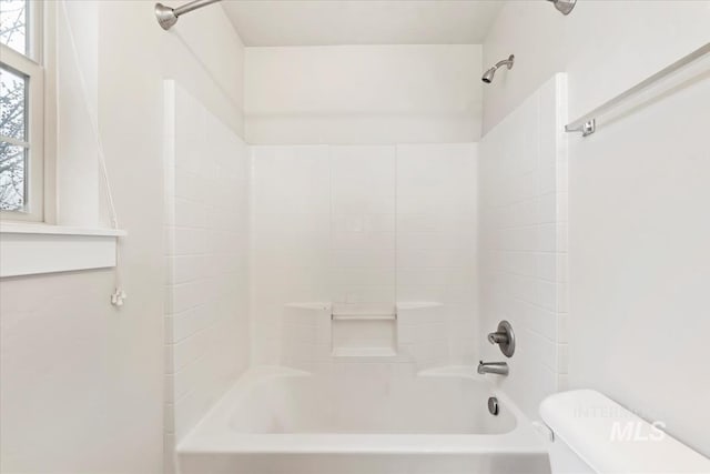 full bathroom with toilet and bathtub / shower combination