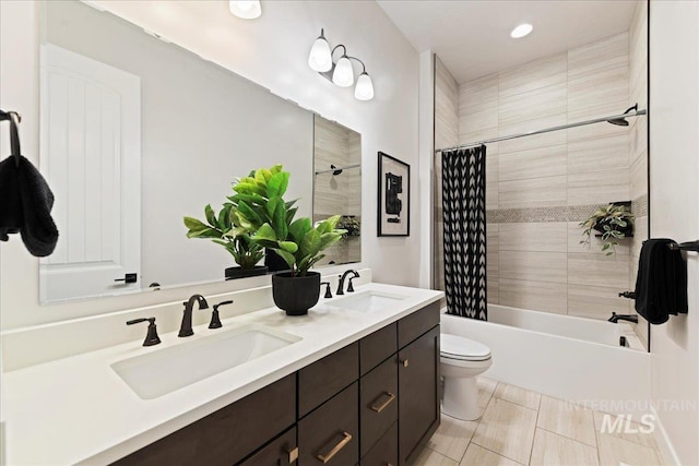 full bathroom with shower / tub combo, vanity, and toilet